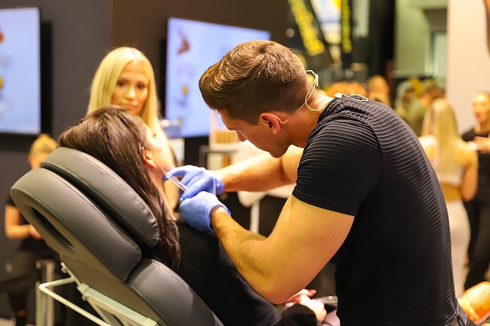 Practitioner giving a Botox injection to a patient's face
